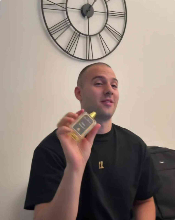 A modern gentleman spraying a premium, long-lasting signature cologne by Chez Pierre Perfumes in Dubai