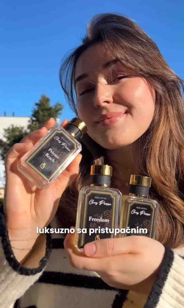 A woman enjoying a sweet, high-quality luxury fragrance by Chez Pierre Perfumes